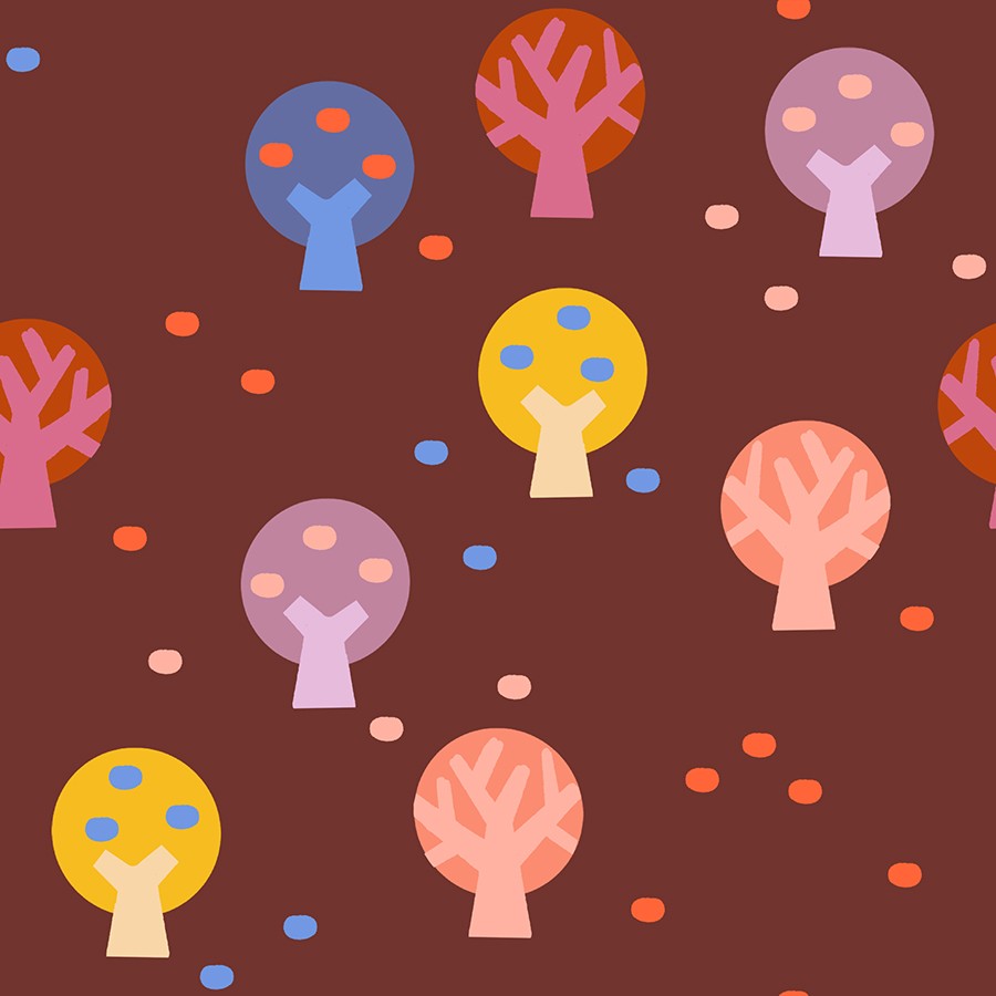 Deep cranberry fabric with playful abstract trees in yellow, purple, pink, and blue tones scattered across the design.