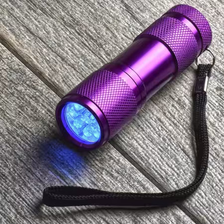 Quilters Ultraviolet Light tool for detecting fabric brighteners and testing quilt fabrics

