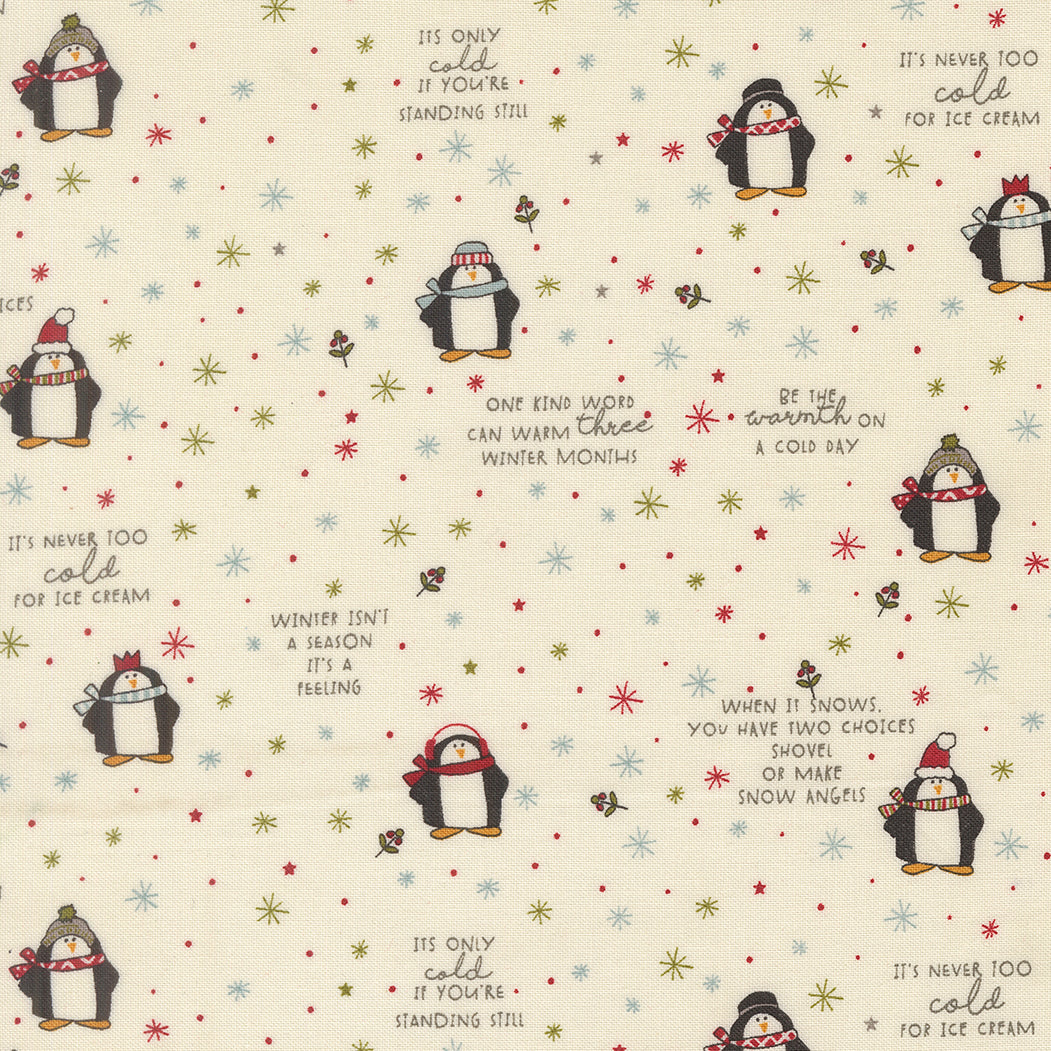 Patterned fabric with penguins, snowflakes, and winter sayings on a cream background.