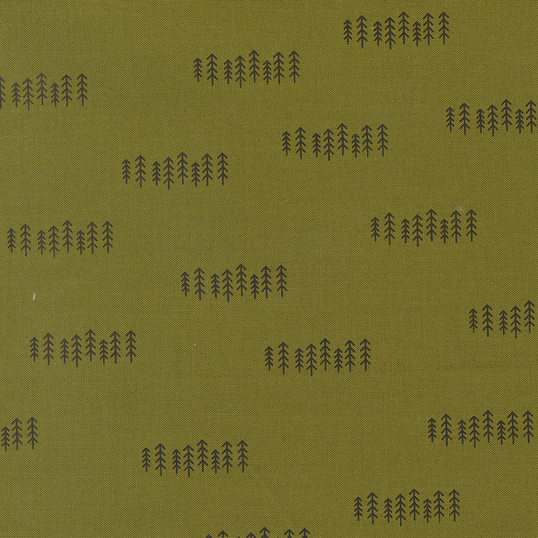 Pattern of trees on a green fabric background