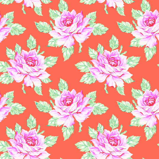 Coral fabric with large pink and lavender roses and mint green leaves in a bold repeating floral pattern.