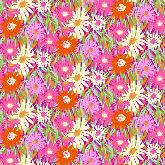 Bright pink fabric with overlapping daisies in red, cream, and magenta tones with green leaves in a lively floral pattern.