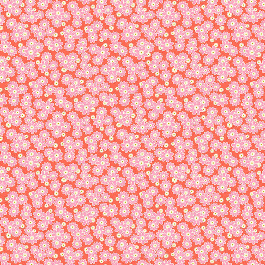 Coral fabric with dense clusters of small pink and white daisies featuring yellow centers in a cheerful repeating floral pattern.