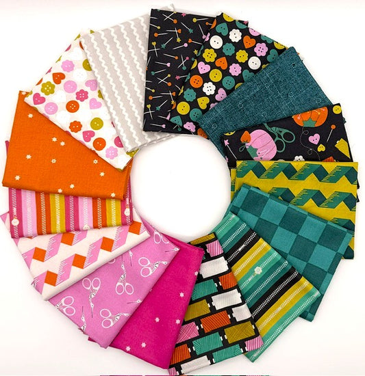 Flat lay of the Bits & Bobs fat quarter bundle by Sarah Hearts for Figo Fabrics, showing folded quilting cotton prints arranged in a circle with colourful sewing-themed designs, SKU FQBITSBOBS