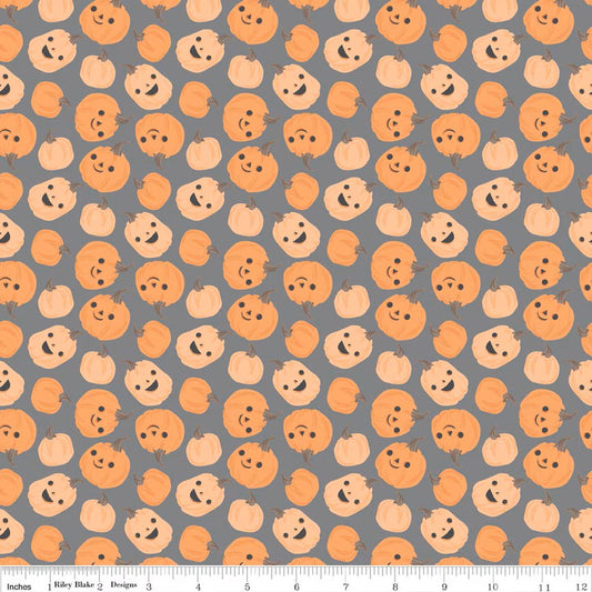Pattern of cartoon pumpkins with faces on a gray background