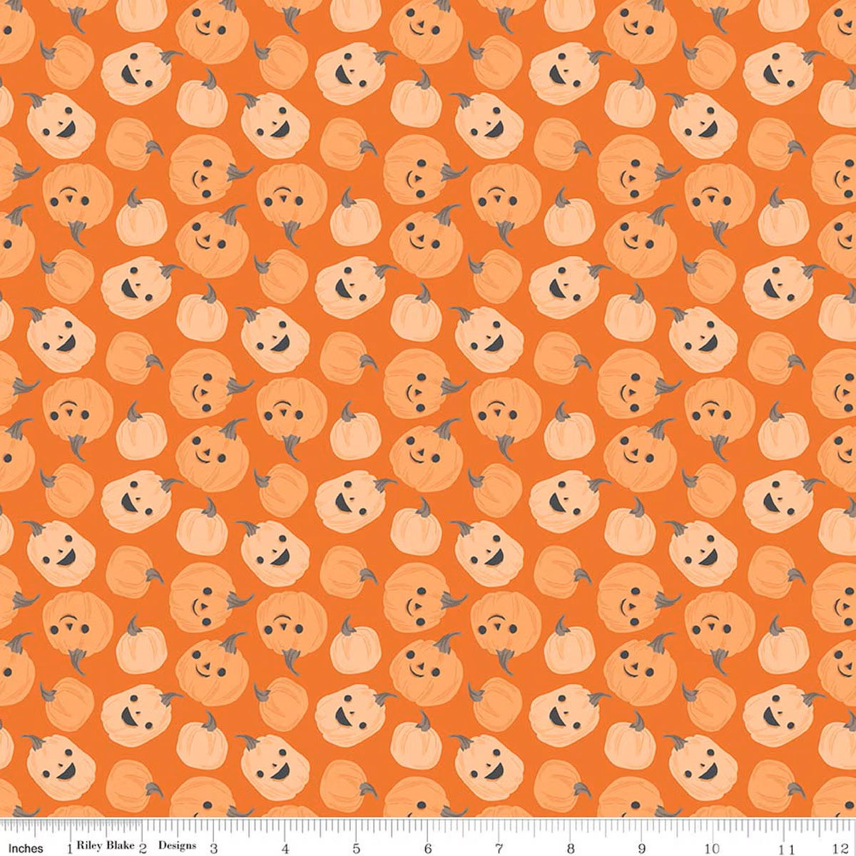 Pattern of smiling pumpkins on an orange background with a ruler at the bottom.