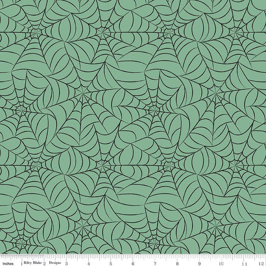 Green spider web pattern on a green background