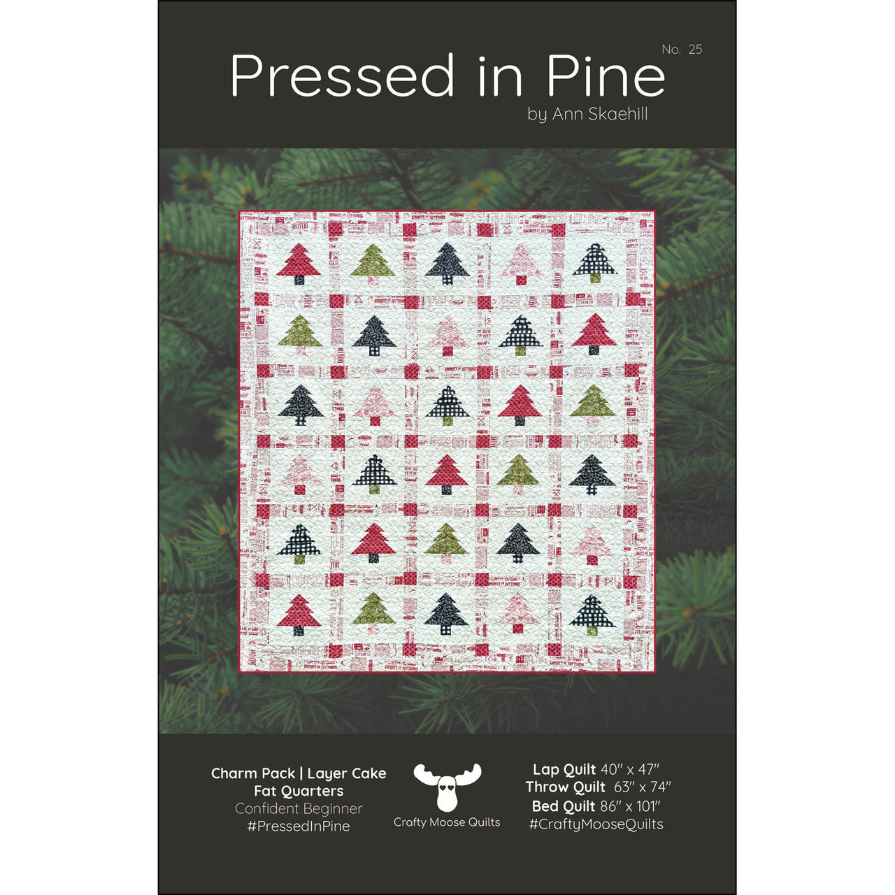 Pressed in Pine quilt pattern by Ann Skaehill for Crafty Moose Quilts — Christmas tree quilt in red, green, and navy on cream background
