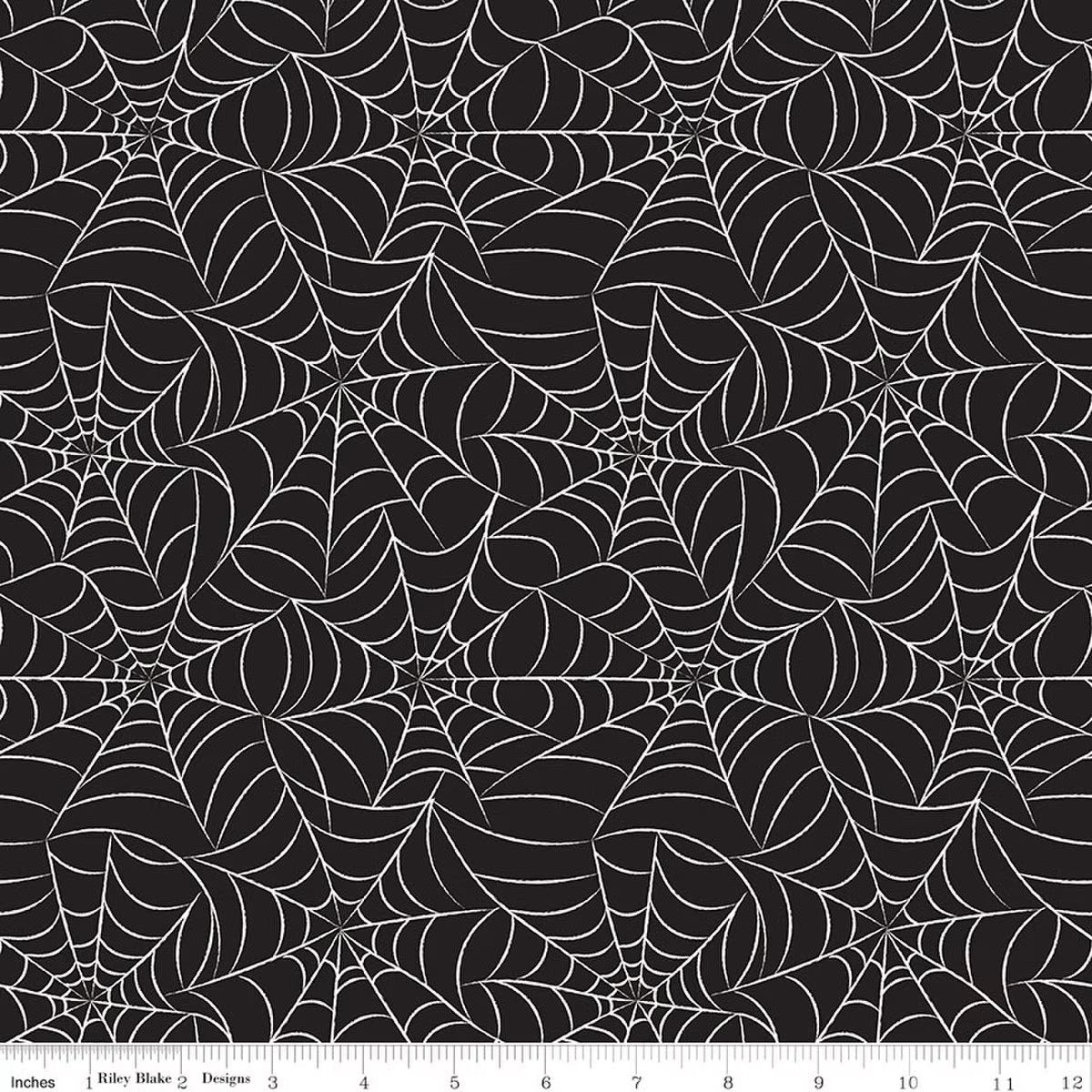 Pattern of spider webs on a black background with a ruler at the bottom.