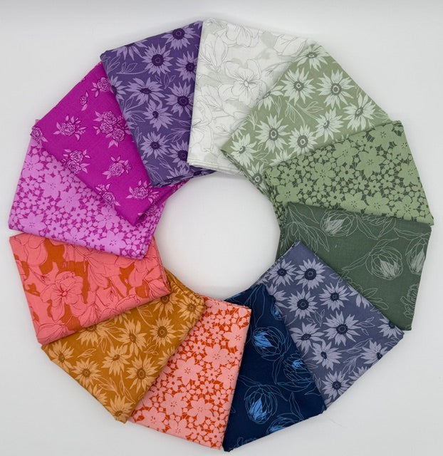 Circular arrangement of fabric swatches with various floral patterns on a white background