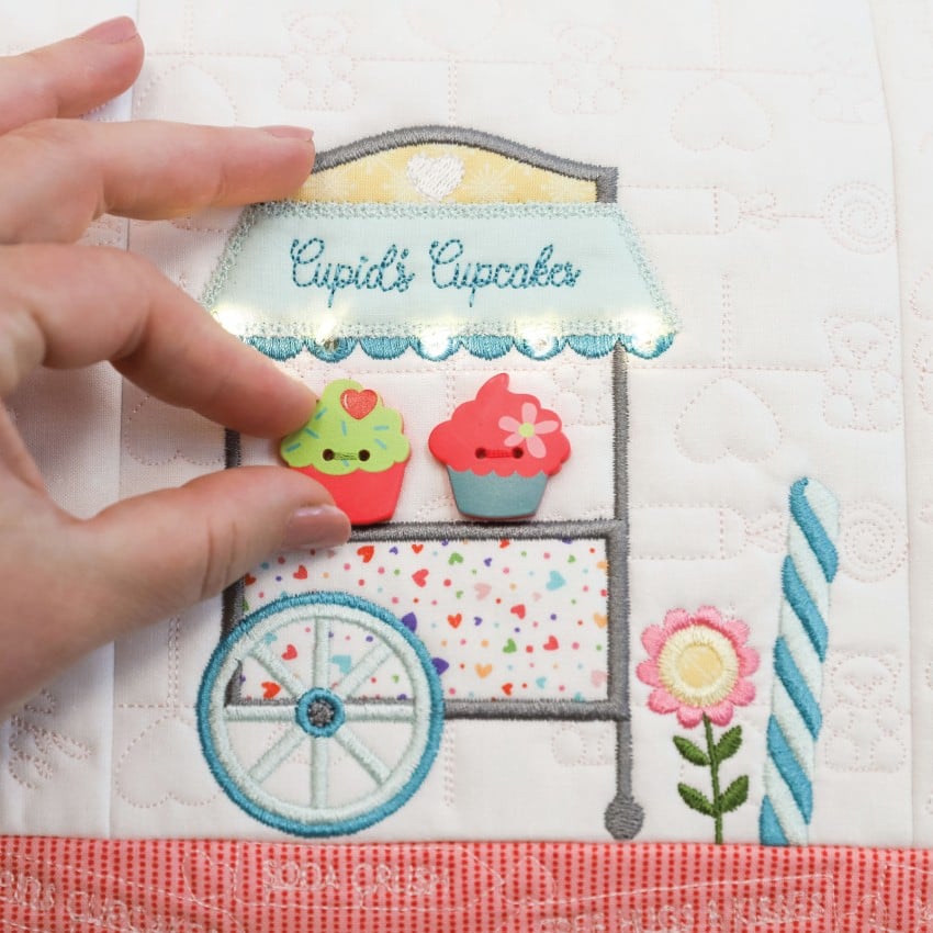 (Detail/contents): Kimberbell Sweetheart Street embellishment kit contents showing ribbons, trims, and decorative elements