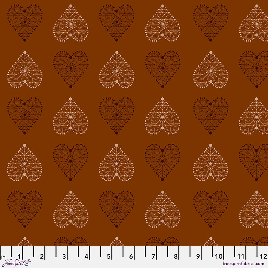 Enrapture Armour Spice quilting fabric by Giucy Giuce for FreeSpirit showing geometric armor pattern in warm spice tones