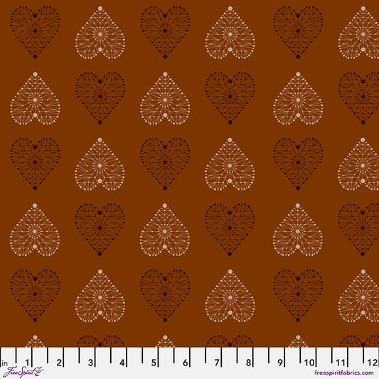 Enrapture Armour Spice quilting fabric by Giucy Giuce for FreeSpirit showing geometric armor pattern in warm spice tones