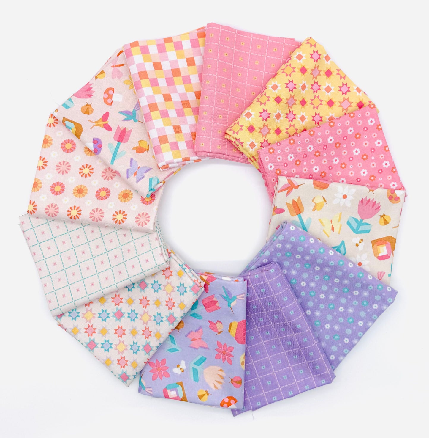 Patchwork by Liza Taylor for Riley Blake 12 SKU half yard bundle showing coordinating fabrics in peach, pink, purple, and vanilla colorways
