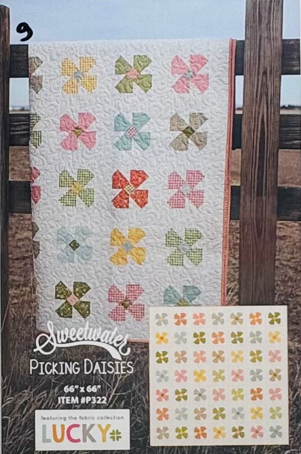 Picking Daisies quilt kit front view featuring Lucky fabric collection by Sweetwater with dogs, plaids and floral designs