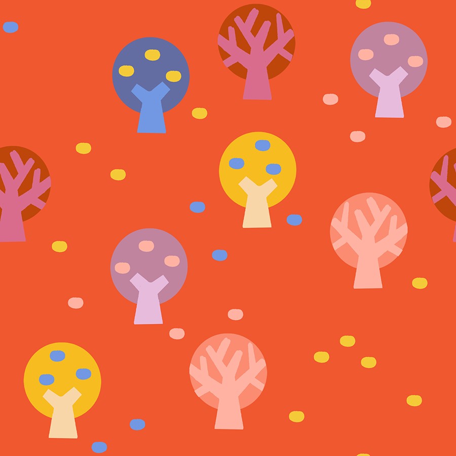 Warm red fabric with playful abstract trees in yellow, purple, pink, and blue tones scattered across the design.