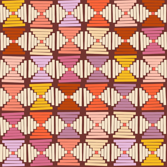 Cranberry fabric with geometric stacked trapezoid pattern in warm shades of pink, orange, yellow, and cream.