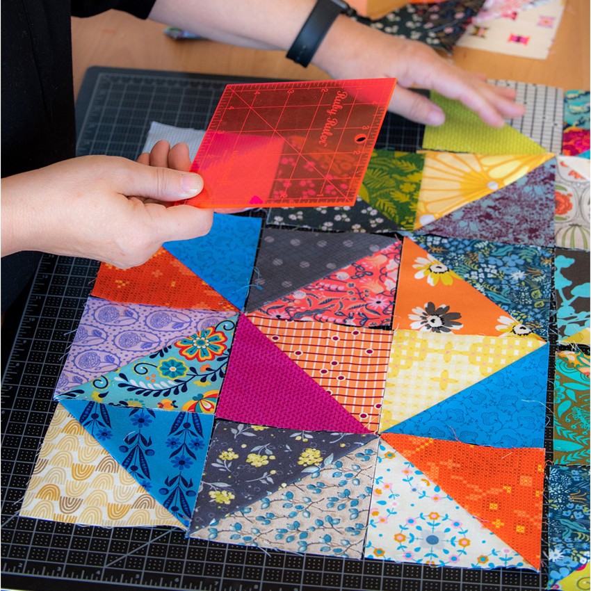 Ruby Ruler by Wise Craft in use showing colour value lens feature for fabric selection