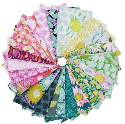 Assorted colorful fabric swatches arranged in a circular pattern on a white background