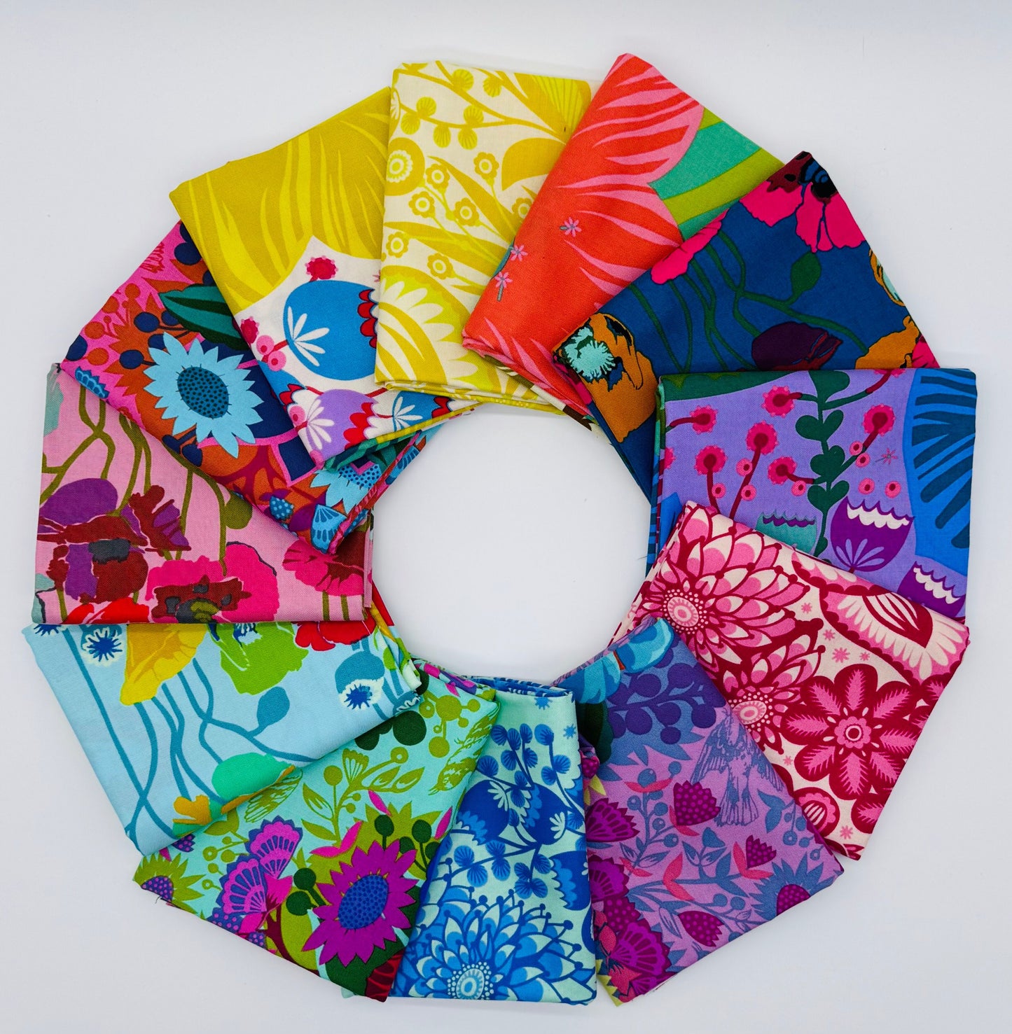Overdressed fabric bundle by Anna Maria Textiles for Northcott - 12 half-yard cuts featuring vibrant geometric prints in primary, coral, cobalt, limerick, grape, and juicy colorways