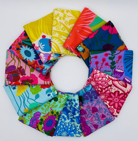Overdressed fabric bundle by Anna Maria Textiles for Northcott - 12 half-yard cuts featuring vibrant geometric prints in primary, coral, cobalt, limerick, grape, and juicy colorways